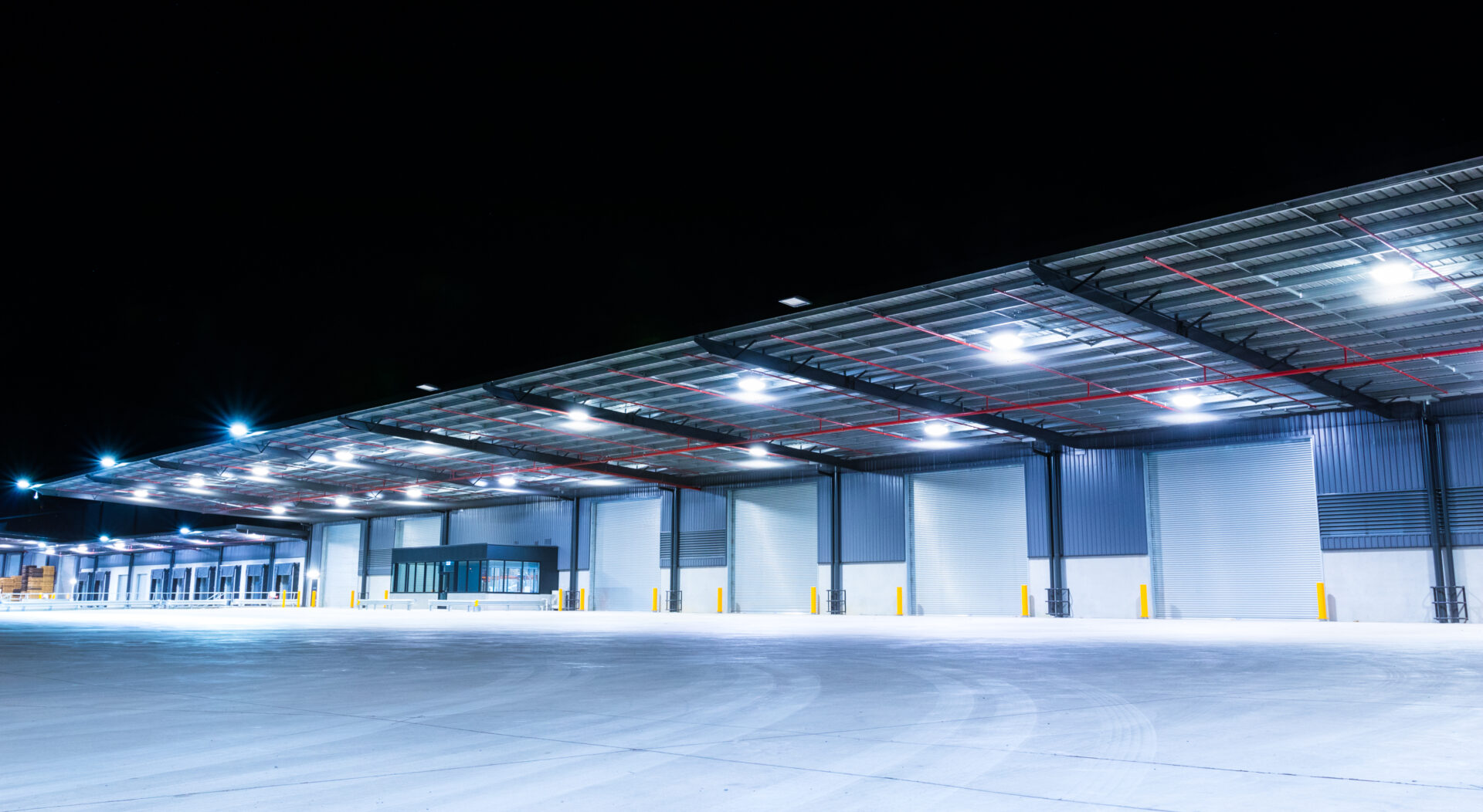 Exterior of a large industrial warehouse in a commercial zone. Industrial Building Design & Construction
