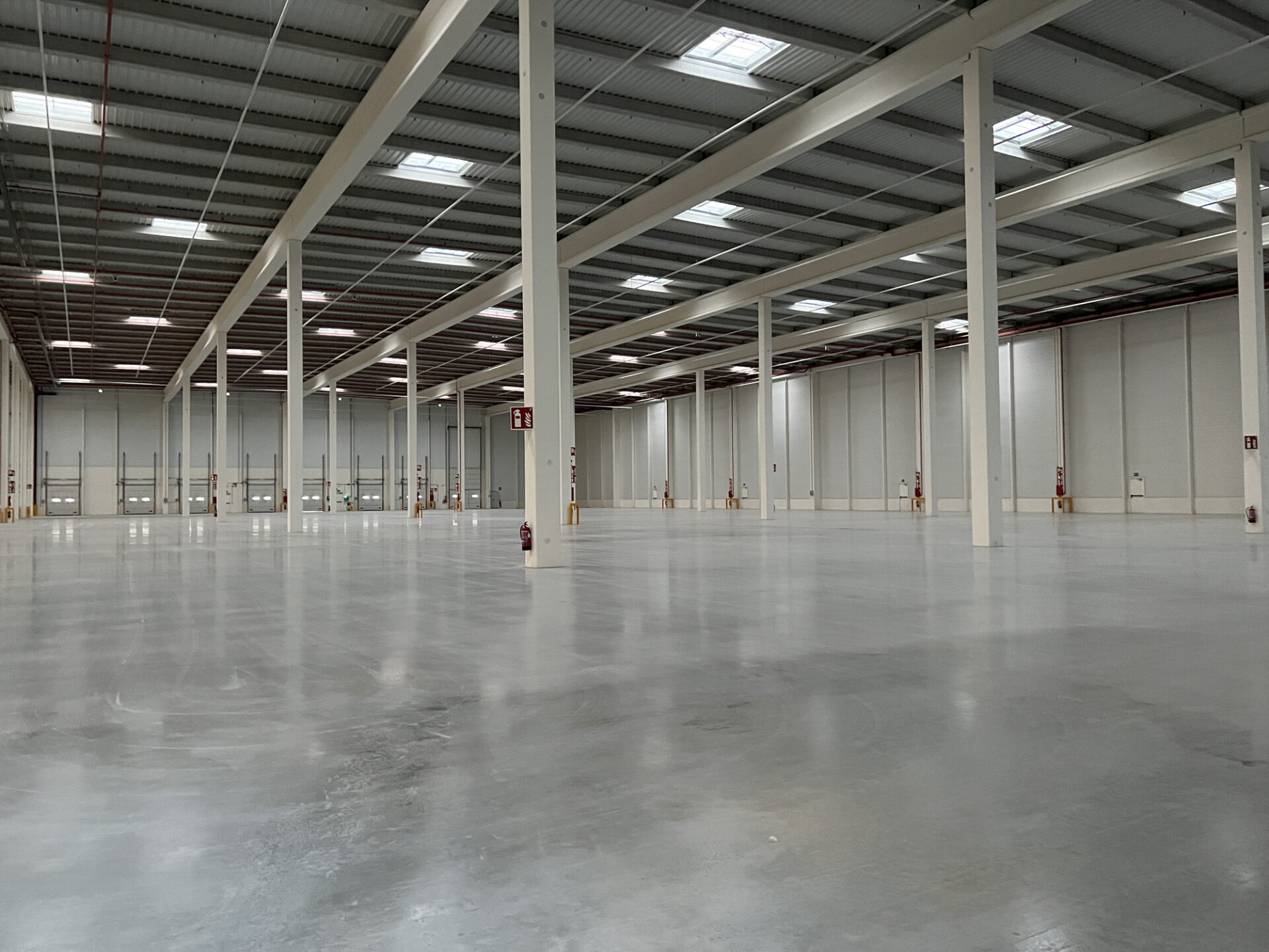View of the interior of an empty modern industrial building. Industrial Building Design & Construction